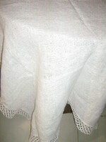 Elegant woven tablecloth with a beautiful white lace edge