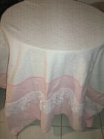 Beautiful pink jacquard pattern lace bedspread at the headboard