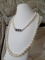 Genuine saltwater cultured pearl string with brilled white gold clasp