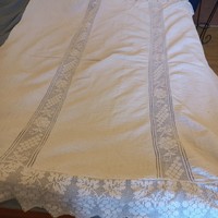 Old woven tablecloth or blanket.