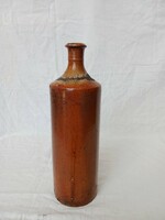 Old brown-glazed brandy bottle