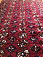 Tekke, hand-knotted, woolen Persian rug, 208x127 cm, in good condition, but slightly damaged at one end