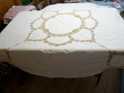 Pale beige embroidered cotton lace tablecloth.