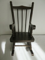 Old carved wooden baby rocking chair. Negotiable!