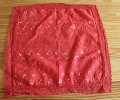 Red textile handkerchief with lace edge