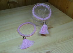 2 Colored oval-shaped tassel bracelet made of glass beads, the socket of the tassel is gold-colored
