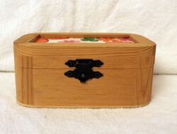 Small wooden box with a flowered roof