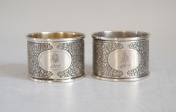 Pair of silver napkin rings. Monogrammed nf68 in art deco style with flower pattern
