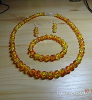 A jewelry set made of imitation amber pearls is eternal elegance.