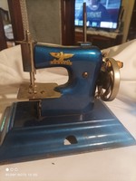 Mini sewing machine works