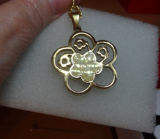 Medical steel pendant with chain, shiny surface, gold color, flower shape.