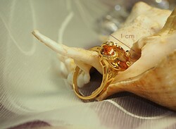 Gold-colored (goldfilled) ring with a champagne-colored stone