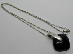 Beautiful onyx stone pendant on a silver necklace
