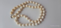Vintage off-white plastic string of beads, extra long