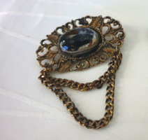 Old brooch with badge