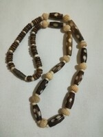 Handcrafted, carved bone and horn pearl necklace.