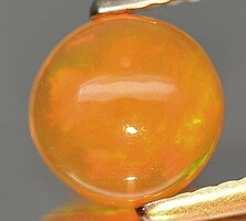 Real, 100% product. Orangish multi-color Ethiopian gem opal 0.99ct (vsi)!! Its value: HUF 52,300!
