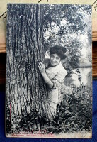 Antique Bergeret photo postcard of a lady hiding behind a tree