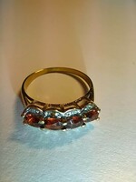 9 Kt gold ring with garnet/diamond stones.