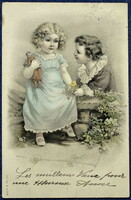 Antik A&M B színezett grafikus üdvözlő képeslap kisfiú kisleány játékbaba