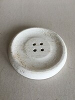Rustic turned wooden button for decorative purposes