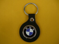 BMW metal keychain on a leather background