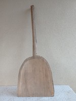 Old carved wooden shovel