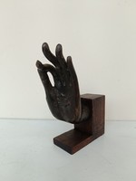 Antique patinated Buddhist teaching hand holding bronze blessing hand on a wooden pedestal buddha