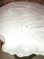 Beautiful antique snow-white hand-crocheted and embroidered tablecloth