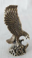 Miniature brass figure of a flying eagle catching a snake