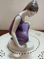 A diving girl in a purple dress from Raven House