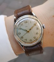 Vintage military watch from the 1940s, with a mechanical movement! With Tiktakwatch service card!