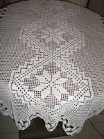 Beautiful snow-white handmade crochet lace tablecloth