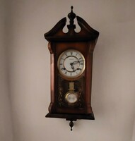 Old wall pendulum clock