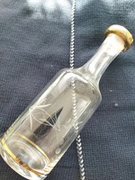 Polished wine glass, bottle