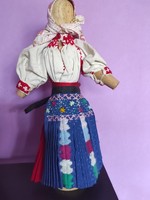 Doll in folk costume.