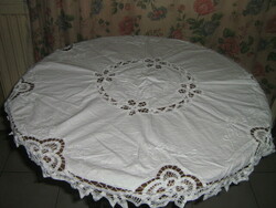 Dreamy white floral hand embroidered sewn round lace tablecloth
