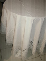 A beautiful snow-white antique huge madeira tablecloth with a lace edge