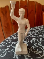 Porcelain figure carrying the Olympic flame