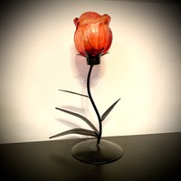 Old wrought iron candle holder from the 80s with glass rose chalice candle