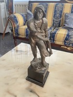 Bronze fisherman statue