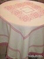 Beautiful hand-embroidered light mauve crocheted cross-stitched tablecloth