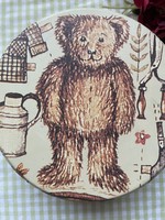 Old metal box with small teddy bear biscuits