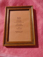 Wooden photo frame with glass plate