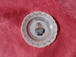Antique, small porcelain ring plate with a female portrait in the middle