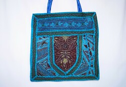 Patchwork women's shoulder bag made of turquoise blue floral Indian textiles, hand and machine embroidered