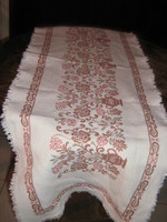 Beautiful floral pattern on vintage woven tablecloth running