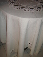 Dreamy handmade crochet flower insert in cream color on huge festive tablecloth