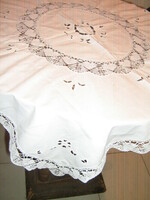 Beautiful white lace tablecloth with lacy edges and embroidered embroidered rice