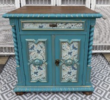 A chest of drawers with an oriental feel or a large nightstand